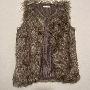 Papaya faux fur vest Med.  only flaw is by tag inside vest.